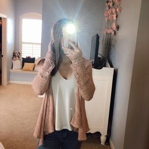 Francesca’s pink cardigan